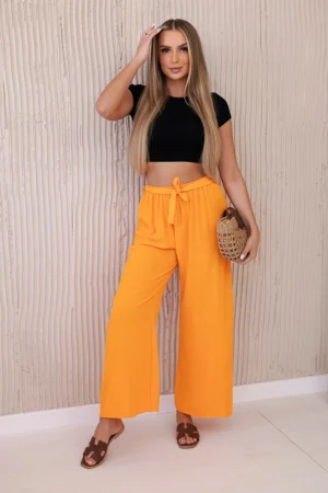 Kelnės su plačia juosmens juosta apelsinas